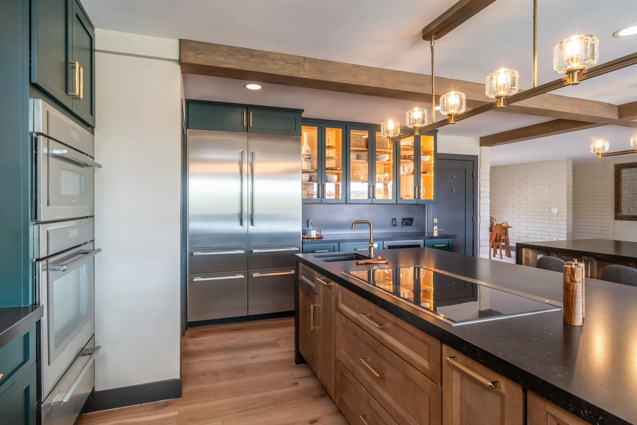 deep green double island kitchen cooking area